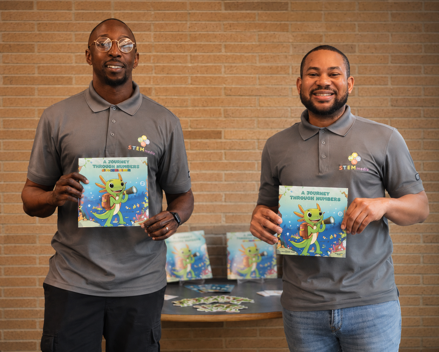 Ralph Abraham and Val Lucien, STEMtacular founders, holding the book